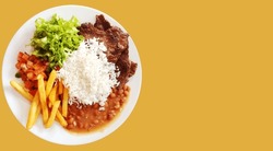 Traditional Brazilian meal named prato feito. Business, presentation with space to write text