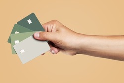 Template of several credit cards in the man's hand. 