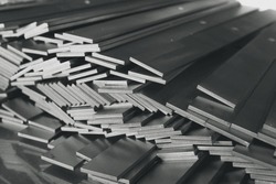 Stack of stainless steel flat bar of background. 