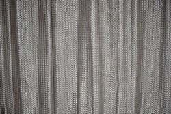 designer curtains of zigzag triangular patterns in cream color with wrinkles on it
