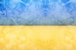 Defocus Ukrain flag. Energy prices. Cold winter season. Power problem. Energy crisis in Europe. War sanctions. Russia dependence. Snowing weather. Out of focus.