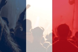 Protests France Paris. France flag. Protest in France. Rise hand. Pension reforms. Out of focus.