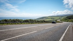 Scottish road trip. A view south along the arterial A9 road north of Helmsdale in the north east of Scotland. The road is one of the most northerly A roads on the British mainland.