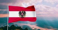 Austria  national flag cloth waving on beautiful sky.