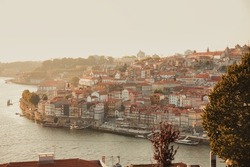 View of  traditional  boats in the morning on river Douro with Porto city in the background, Portugal. Viticulture in the Portuguese villages at sunrise 