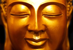 Buddha gold statue close-up