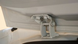 Close up of the car trunk door hinge
