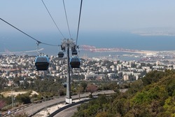 Cable way above Haifa city, Israel. Blue cable car close up photo. Public transportation in Israel. 