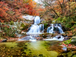 Waterfall and water vortex of autumn Bangdong Valley at Mt Bangtaesan, Korea.
