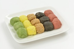 Korean food Five-Colored Gyeongdan Tteok(rice ball cake) on a white dish with background, South Korea
