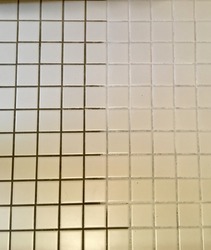 Before and after results from cleaning the grout on the bathroom floor