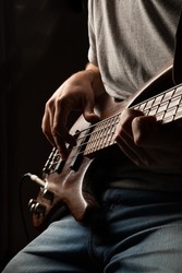 
playing the bass, bass and guitar lessons