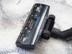 Dirty vacuum cleaner brush with dust. Cleaning concept