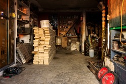 interior of a rural barn with a workshop and a repository of materials