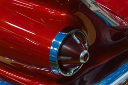 background - fragment of the surface of  red vintage car with tail light