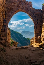 beautiful stone arch in the ruins of the abandoned ancient village of Gamsutl, Dagestan