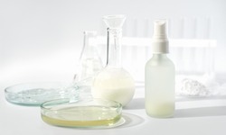 fermented beauty concept. petri dishes, laboratory glassware and cosmetic product on a table. enzyme cosmetology ingredient