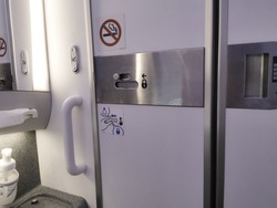 Door from Inside Airplane lavatory .Small space  Inside the airplane toilet
