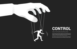 Puppet Master controlling Silhouette of businessman. Concept of manipulation and micromanagement