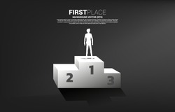 Silhouette of businessman standing on first place podium. Business Concept of winner and success
