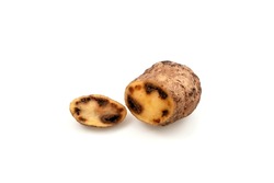 Rotten spoiled potatoes cross-section on white background. Concept - Incorrect storage of products. Reduction of organic food waste.
