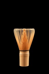 Chasen or Bamboo tea whisk on black background, close-up. Accessory for whipping Matcha tea.