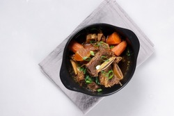 Galbijjim or KalbijJim is Korean Traditional Braised Beef Short Ribs Dish in a Rich Sauce.