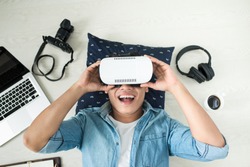Top view of Man wearing virtual reality goggles