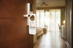 The hotel room with DO NOT DISTURB sign on the door