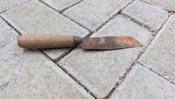 Rusty knife on the floor