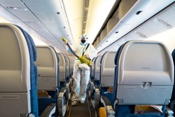 Covid-19 disease prevention. Aircraft interior cabin deep cleaning for coronavirus.