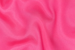 Soft, luxurious dark pink or satin fabric. It can be used as a glamorous wedding texture or background for a lovers ' holiday.