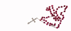 Catholic rosary and crucifix on white background
