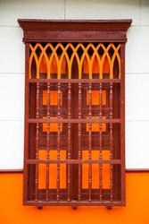 Colombian colonial house - Wooden window with an orange colonial style, located in a Colombian town