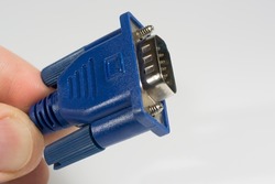 vga connector cable for monitor close up in the hands of an IT engineer. copy space.