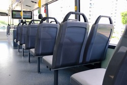 Bus interior: back view of seats on empty double decker bus. Blank advertising space; for mockup display; seat sticker wrap.
