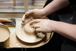 Clay modeling training on a potters wheel, clay master class. Art, creativity. Modeling clay, cultural traditions, hobby
