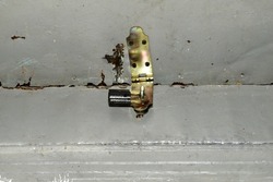 The picture shows a padlock with lugs on the hatch covering the attic.