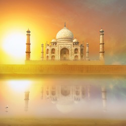 Taj Mahal India Sunset. Agra, Uttar Pradesh. Beautiful Palace with reflection in river. Wonderful landscape.