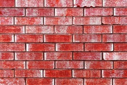 a red stained painted dirty old weathered red vintage worm brick wall stained retro style surface aged alley bricks