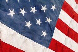a historic American flag worn old vintage patriotic backdrop America faded background symbol