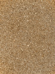 a closeup beach sand ocean low time sandy shore sea crushed rock shells overhead vertical