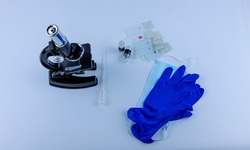 laboratory microscope with samples of viruses on glass, on a white background