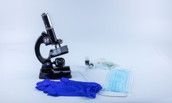 laboratory microscope with samples of viruses on glass, on a white background