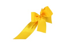 Decorative yellow ribbon and bow cut out and isolated on white background