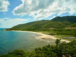 A beautiful beach composed of mountains, sand, sea and sky. SUPER HIGHRES RESOLUTION
