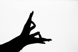 Black and white image of hasta mudra or indian traditional dance form's hand posture with white background.