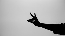 Black and white image of hasta mudra or indian traditional dance form's hand posture with white background.
