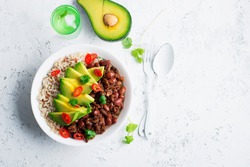 Beef beans bowl with brown rice and half avocado for a healthy diet. Top View