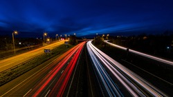 Motorway traffic light streaks with dusk blue sky